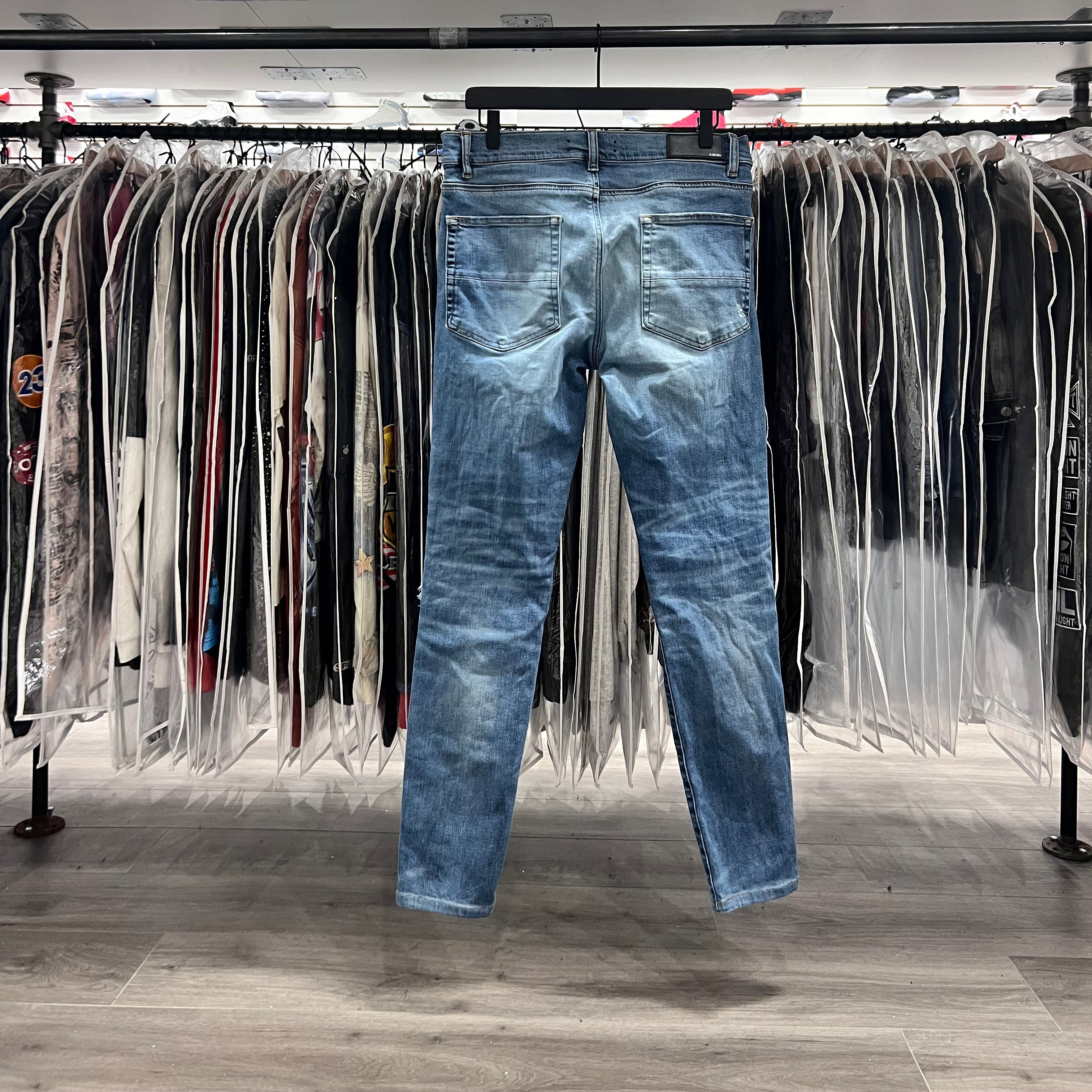 Amiri MX1 Light Wash Black Patch Jeans (Lightly Worn)